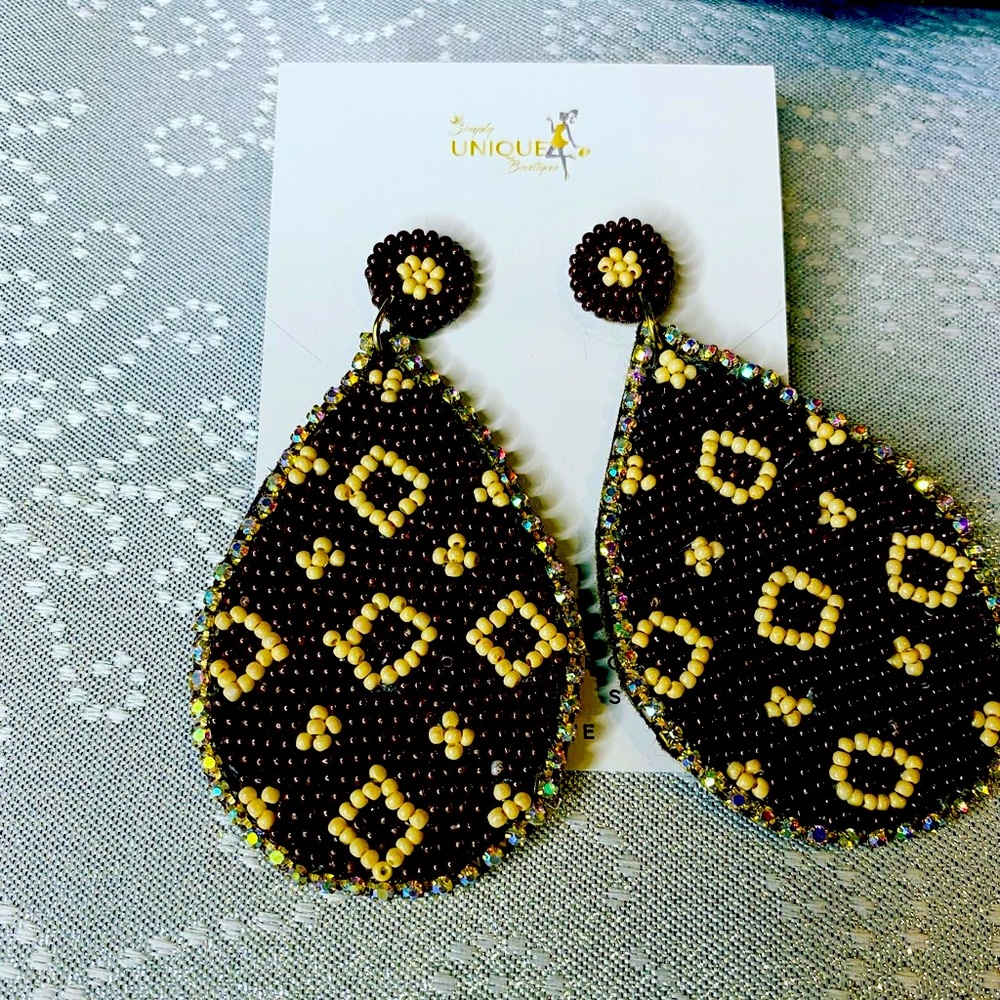 Fun designer iconic earrings. Light weight.